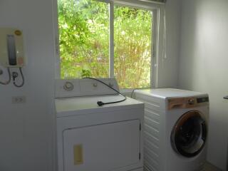 Laundry room with washing machine and dryer