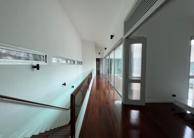 Spacious hallway with hardwood floors and modern design