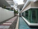 Modern building with adjacent swimming pool and pathway