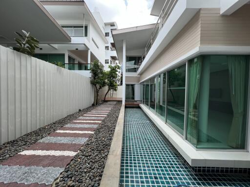 Modern building with adjacent swimming pool and pathway