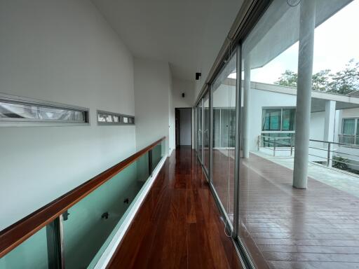 Corridor with glass window showcasing a modern exterior