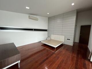 Spacious bedroom with air conditioning and minimalistic design