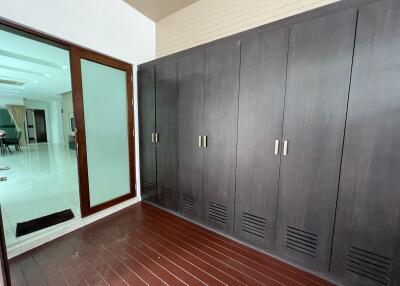 Bedroom with large wooden wardrobes