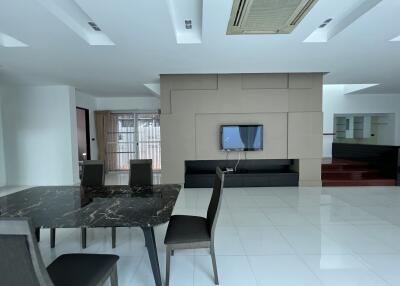 Spacious and modern living room with dining area