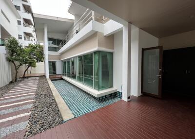 Modern exterior with pool and wooden deck