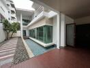 Modern exterior with pool and wooden deck