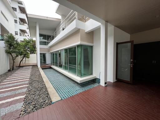 Modern exterior with pool and wooden deck