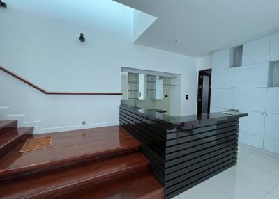 Modern living area with staircase and sleek design