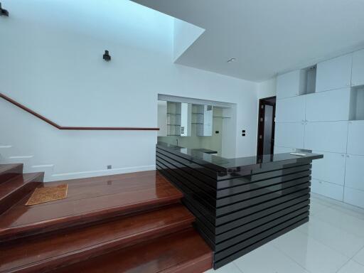 Modern living area with staircase and sleek design