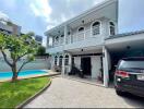 Two-story house with carport and swimming pool