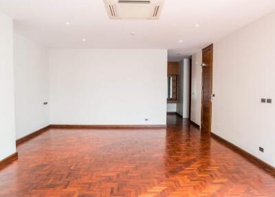 Spacious living room with wooden flooring