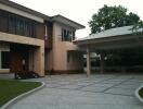 Exterior view of a modern house with driveway and carport