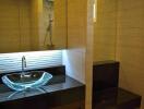 Modern bathroom with glass sink and contemporary design