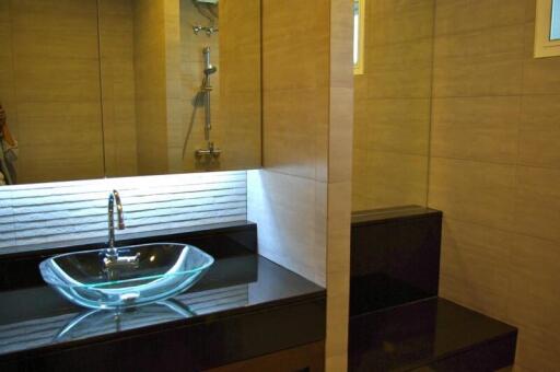 Modern bathroom with glass sink and contemporary design