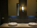 Modern bathroom with dual sinks and ambient lighting