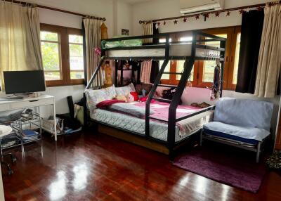 Bedroom with a bunk bed and desk