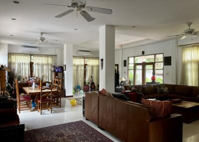 Spacious and well-lit living room with dining area