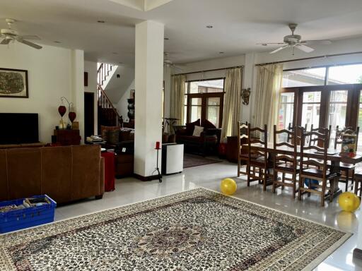 Spacious living and dining area with natural lighting and modern amenities