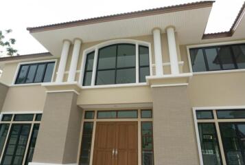 Facade of a modern two-story house with large windows