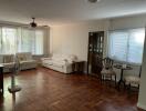 Spacious living room with wooden flooring and furniture