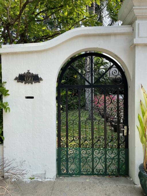 Decorative metal gate with house number