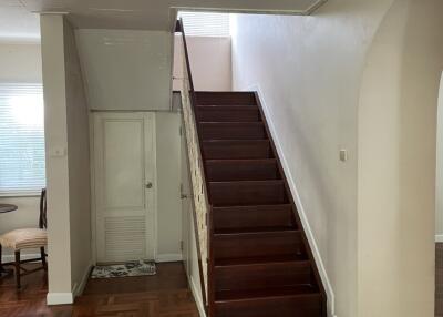 Interior view with staircase and wooden flooring