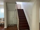 Interior view with staircase and wooden flooring