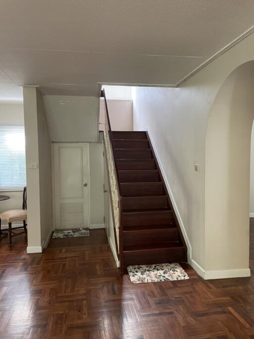 Interior view with staircase and wooden flooring