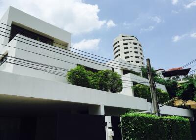 Exterior view of a modern building with greenery