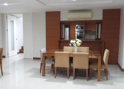 Modern dining area with table and chairs