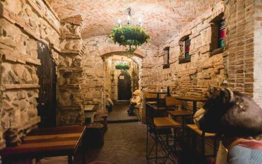 Rustic stone-walled room with arched ceiling