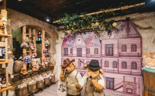 Teddy bear themed store with decorative house background