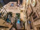 Decorative indoor stairway with art and stained glass windows