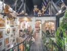 Whimsical interior of a property featuring a suspended bridge adorned with teddy bears and numerous decorative elements