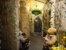 Stone hallway with arched ceiling and decorative elements