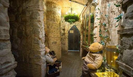 Stone hallway with arched ceiling and decorative elements