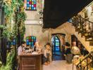 Lobby area with colorful stained glass windows and plush toys