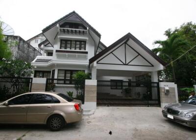 Front view of a modern house with a gable roof and attached garage