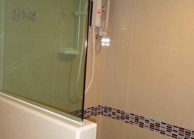 Modern bathroom with tiled walls and a shower