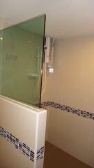 Modern bathroom with tiled walls and a shower