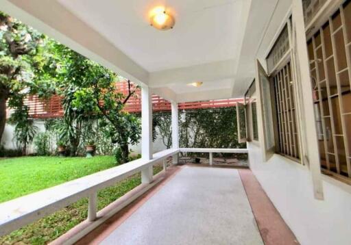 Covered outdoor patio area with garden view