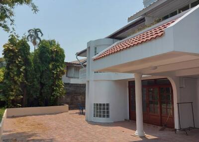 Exterior view of a house with a tiled patio