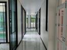 Spacious marble-floored hallway with glass doors