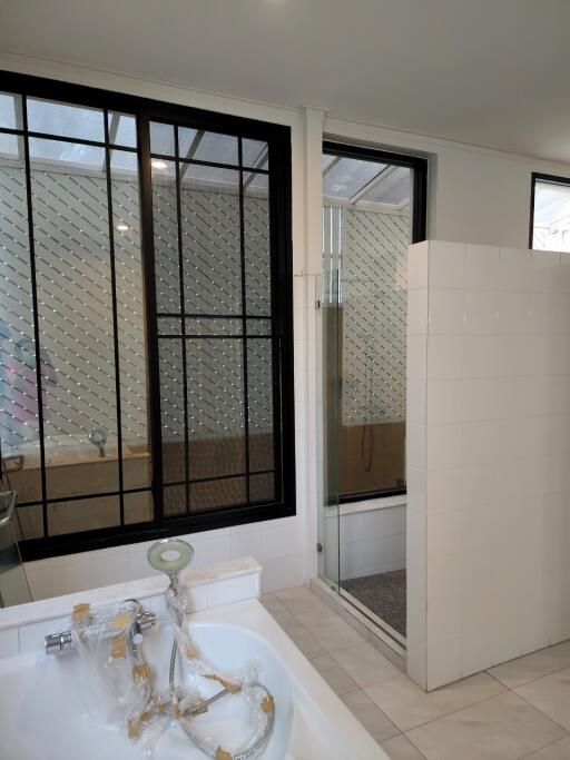 Modern bathroom with large windows and a shower area