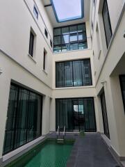 Indoor pool area with large windows and modern design