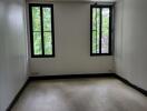 Empty bedroom with windows