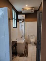 Modern bathroom with bathtub and toilet