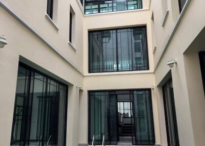 Modern courtyard with pool and glass windows