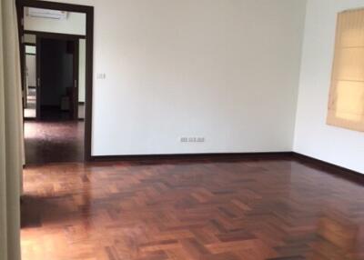 Spacious living room with wooden floor