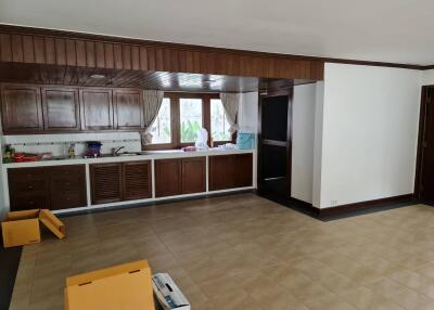 Spacious kitchen with wooden cabinets and open layout